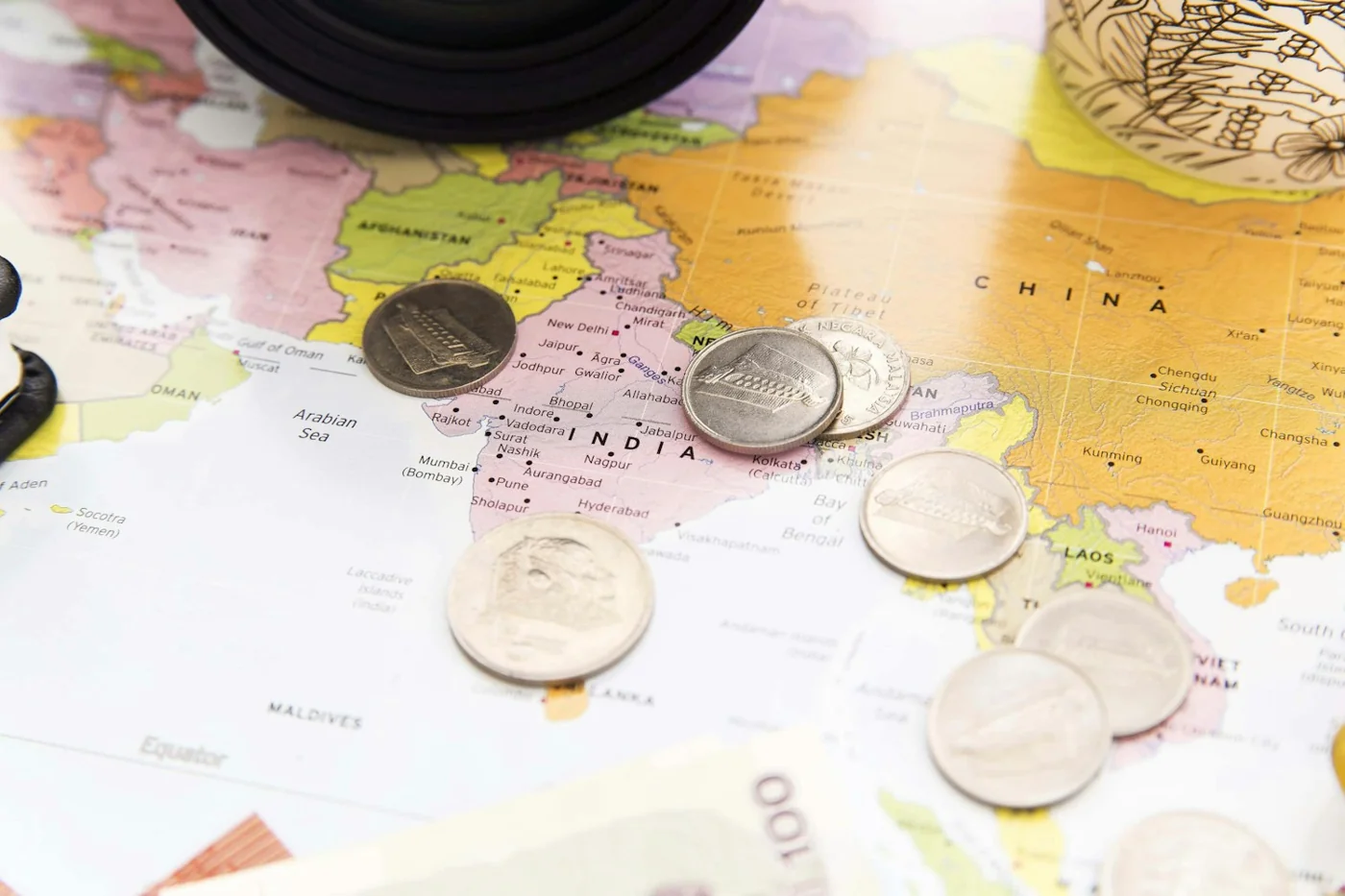 Coins on a travel map